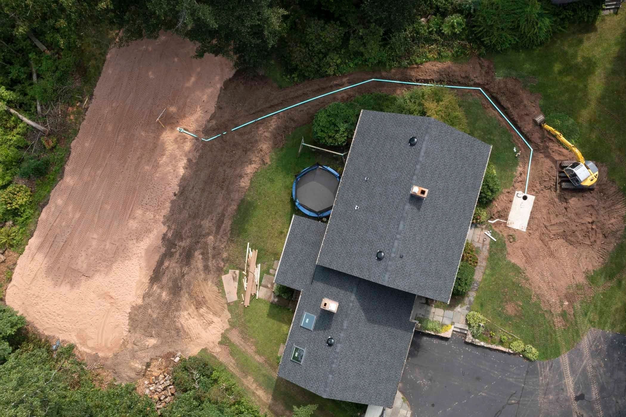 Overhead view of a completed full septic system and finished grade around a Shoreline home.