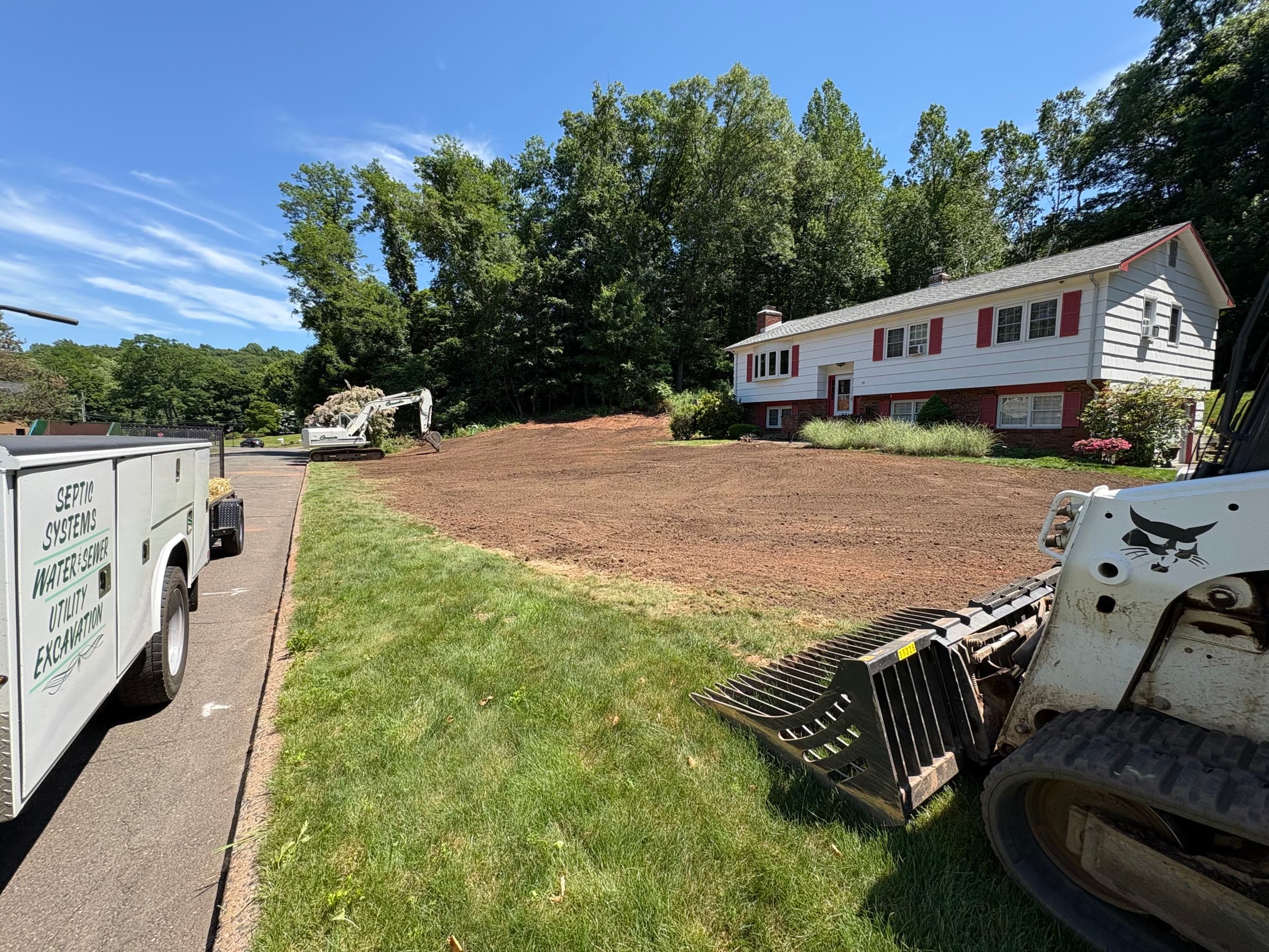 Finished grade over a septic install beside a Shoreline home.